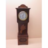 An oak case miniature longcase clock with French movement 8 day, 23cm high, running in saleroom