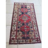 A hand knotted woollen Hamadan rug, 2.07m x 1.05m