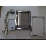 Three hallmarked silver frames, largest 17cm x 12cm, some small dents to all, 2 missing easel