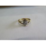 A hallmarked 18ct gold and diamond ring size O approx 3.4gs, some usage marks but generally good