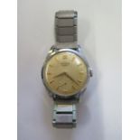 A Longines manual wind gents wristwatch, case 34mm wide, running in saleroom, some wear and spotting