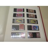An assorted collection of world stamps in eleven albums