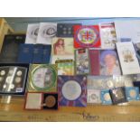 A collection of assorted proof coin sets and other British coins and a Victorian commemorative