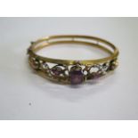 A hallmarked 9ct gold amethyst and pearl bangle, 7cm x 6cm, approx 10.8 grams, generally good