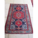 A hand knotted woollen Hamadan rug, 2.04m x 1.25m
