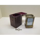 A French brass carriage clock by Robert Sawers, Edingburgh, 12.5cm high with travel case, running in