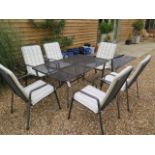 A KETTLER mesh garden table and 6 armchairs including cushions, in sound condition