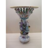 A continental porcelain centre piece, 39cm tall x 27cm diameter top, in generally good condition