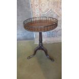 A Georgian style mahogany tripod sidetable with a damaged gallery 73cm tall, 49cm diameter