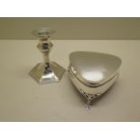 A weighted silver trinket box and a silver candlestick, some general wear to both, total weight