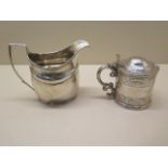A silver mustard with blue glass liner, has wear and rubbing possible repairs, and a silver milk jug
