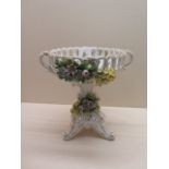A continental floral encrusted centrepiece, 24cm tall x 25cm wide, some foliate chipping otherwise