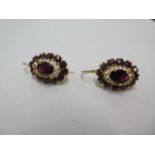 A pair of 18ct yellow gold cluster earrings, possibly garnet, 3cm long x 1.6cm wide, in good