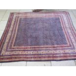 A hand knotted woollen Araak rug, 2.52m x 2.17m