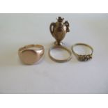 Two 9ct rings, a 9ct charm approx 9.8grams and an 18ct platinum ring missing a stone, approx 2.