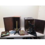 Two microscopes and a selection of slides. Removed from a Cambridge property owned by a University