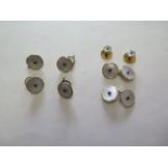 A set of 18ct gold, platinum mother of pearl and sapphire waistcoat buttons, cufflinks, and shirt