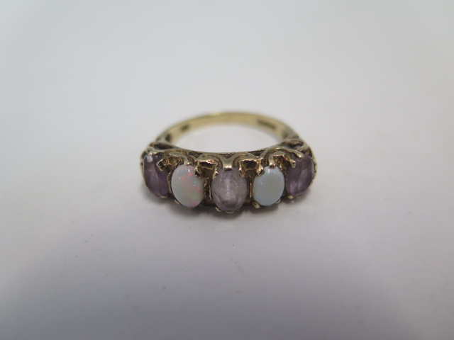 A hallmarked 9ct gold opal and amethyst ring, size N, approx 3.3grams, some wear consistent with use