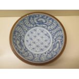 An unusual 18th century chinese 'Batavian' blue and white bowl, underglazed with stylistic foliage