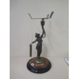 A cast iron brass and copper figural cakestand with knife holder, 47cm tall