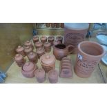 A collection of The Original Suffolk Terracota kitchen ware including spice jars, 21 pieces in total