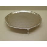 A silver salver, London 1924/5 EBS, 20cm wide, approx 12.7 troy oz, some scratches but generally