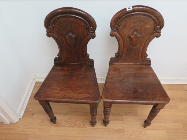 A pair of oak 19th century hall chairs