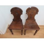 A pair of oak 19th century hall chairs