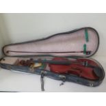 A violin with a one piece 14 1/8 inch back, Boosey and Co label with an unnamed box and hard case