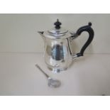 A silver presentation jug and a silver spoon, total weight 20.4 troy oz