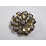 A continental gold and diamond brooch, tests to approx 18ct, 3cm diameter, the central diamond