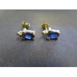 A pair of 14ct yellow gold diamond and sapphire earrings, marked 14K, approx 1cm long, approx 6.4