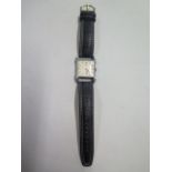 A very attractive Enicar gents watch, steel case has stylish racing car type design, stepped case