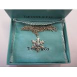 A Tiffany silver snowflake shaped pendant and necklace, stamped 'T & Co .925' approx weight 10.6