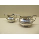 A silver cream jug and sugar bowl, approx 5 troy oz, both generally good