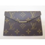 A Louis Vuitton monogrammed leather wallet with gilt metal hardware, 14.2cm wide, in good condition