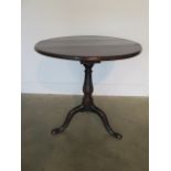 A Georgian oak tripod table with birdcage action, 68cm tall x 68cm diameter, some repairs and