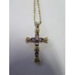 A 9ct gold crucifix pendant and chain inset with diamond and amethyst, overall weight approx 3.8