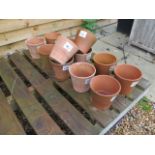A selection of 12 terracotta pots, 15cm high