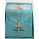 A Tiffany and Co .925 sterling silver and 18ct gold cross pendant and necklace, hallmarked Tiffany