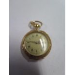 A pretty French gold ladies pocket watch with enamel and gem set back, 3cm wide, tests to approx