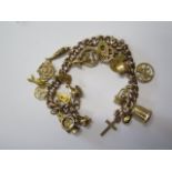 A 9ct yellow gold charm bracelet, 18cm long, total weight approx 35.7 grams, generally good and