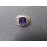 A hallmarked 18ct yellow gold Amethyst and diamond ring, the amethyst approx 10mm x 8mm x 6mm,