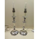 A pair of 18th century style Edwardian plated candlesticks converted to table lamps (Tested), 41cm