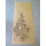 An unframed oriental watercolour on silk of a stag and doe, 102cm x 46cm, overall spotting but