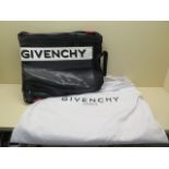 A Givenchy Paris drawstring bag, 46cm x 38cm, with dust cover, labels and Harrods price label for £