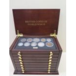 British coins and WWII, 1939-1945, contained in a wooden collectors cabinet, 25.5cm wide, 3