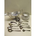 A silver sauceboat hallmarked Birmingham 1928-29, silver spoons, a glass toiletry jar with silver