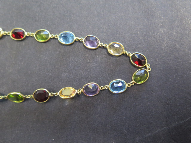 An 18ct yellow gold multigem sapphire, garnet, citrine, peridot necklace, approx 72cms long, total - Image 4 of 4