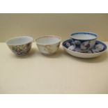 A finely decorated Chinese Qianlong period tea bowl together with two others and a saucer, very